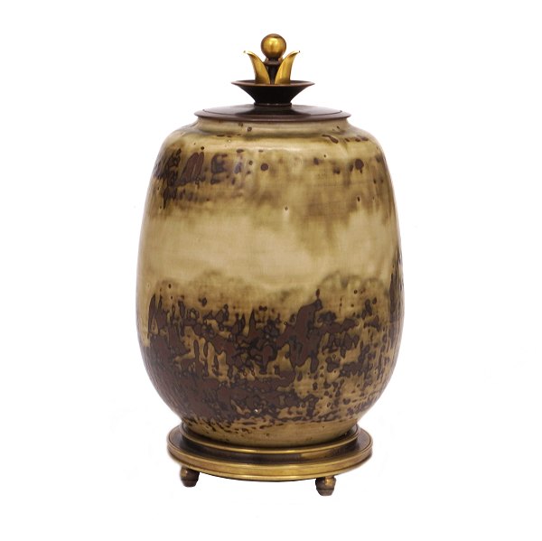 A Danish stoneware lidded jar by Carl Halier, 1873-1948, for Royal Copenhagen. 
Signed 1944. H: 26cm