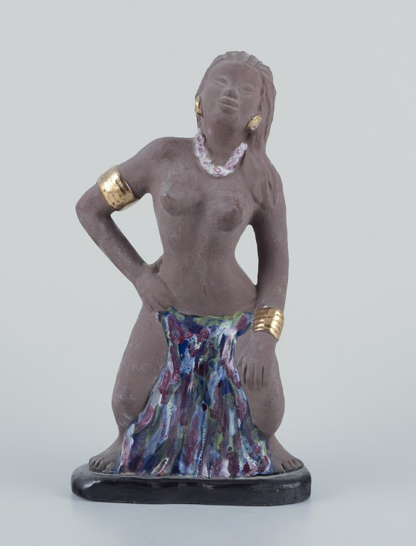 Bengt Wall, Sweden. 
Bali girl in raw and glazed ceramic.