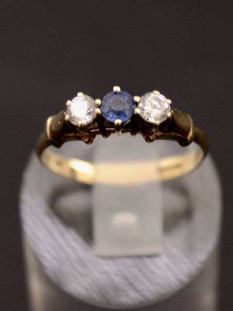 9 carat gold ring with blue and clear stones