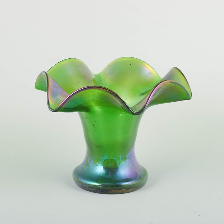 Bohemia, attributed to Loetz. Vase. Ca. 1900.
Mouth-blown green glass vase with iridescent surface in violet and blue tones.