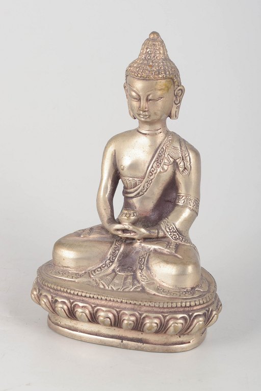 Silver-plated metal Buddha figure.